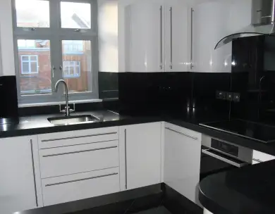 Modern black and white kitchen with bespoke cabinetry in Chigwell Essex