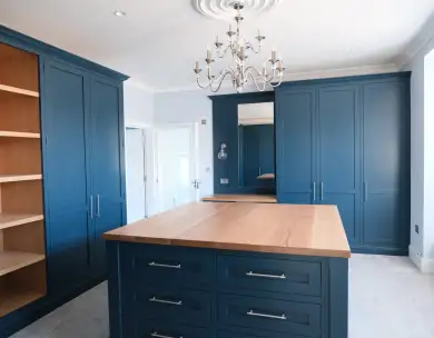 Luxury bespoke blue kitchen with island and fitted cabinetry in Loughton Essex