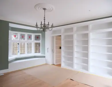 Modern interior refurbishment with bespoke fitted shelving and bay window in Loughton Essex