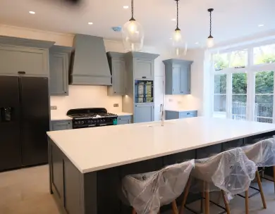 Luxury bespoke kitchen with large island and pendant lighting in Loughton Essex