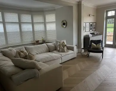 Luxury living room interior with bespoke seating and herringbone flooring in Loughton Essex