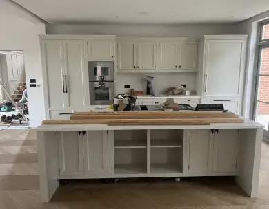 Luxury bespoke kitchen installation with central island and fitted cabinetry in Loughton Essex