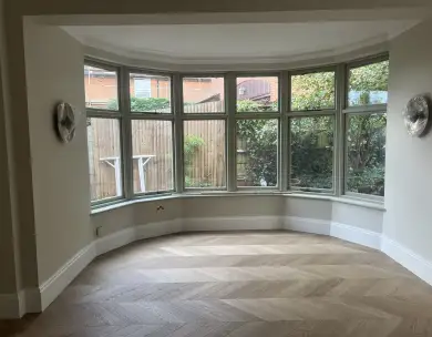 Luxury bay window living room with herringbone flooring in Loughton Essex