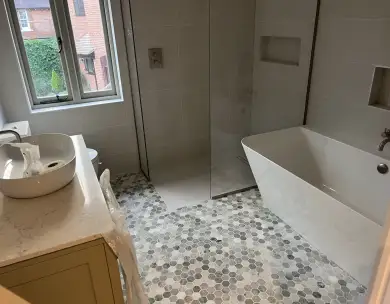 Luxury modern bathroom refurbishment with freestanding bath and walk-in shower in Loughton Essex