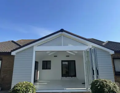 Modern rear extension exterior with bifold doors and vaulted roof in Gillingham Kent