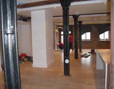 Modern open plan refurbishment interior with exposed steel columns in Loughton Essex