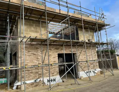 Luxury new build residential construction with scaffolding in Buckhurst Hill Essex