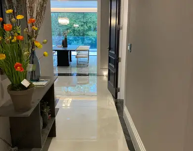 Luxury hallway interior with polished flooring and garden view in Chigwell Essex