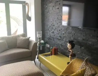 Luxury lounge interior refurbishment with feature wall in Loughton Essex