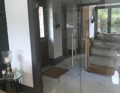 Modern glass door interior refurbishment with marble flooring in Loughton Essex