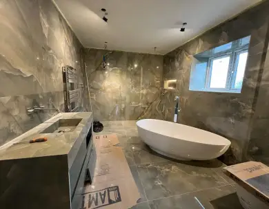 Luxury marble bathroom renovation with freestanding bath in Epping Essex