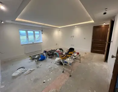 Luxury bedroom renovation with recessed ceiling lighting in Epping Essex