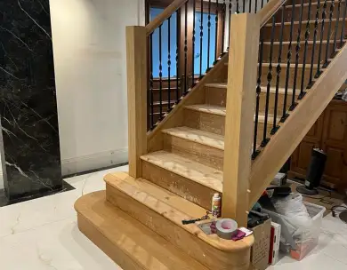 Luxury oak staircase installation with bespoke balustrades in Epping Essex