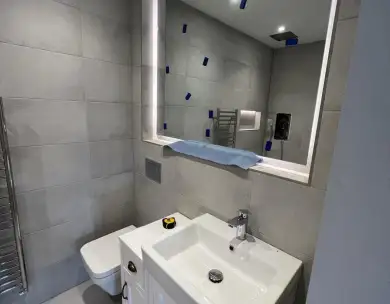 Modern bathroom renovation for shop to flat conversion in Leytonstone London