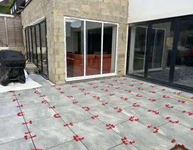 Modern patio area with large sliding doors at residential extension in Loughton Essex