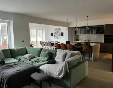 Modern open plan living room and kitchen with central island in Loughton Essex