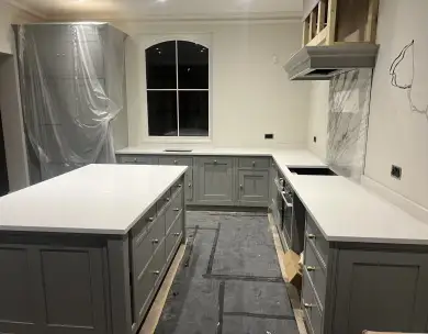 Luxury grey kitchen renovation with bespoke cabinetry and island in Loughton Essex