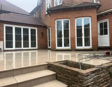 Luxury rear patio extension with bifold doors and outdoor paving in Loughton Essex