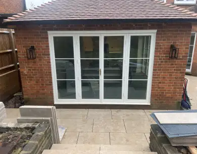Rear house extension with patio doors and outdoor paving in Loughton Essex