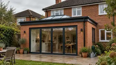Rear house extension in Brentwood with warm brickwork, roof lantern, patio and garden details