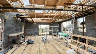 House extension under construction in Buckhurst Hill House extension under construction in Buckhurst Hill showing timber roof structure and building work